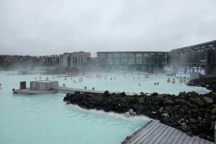 Photo of Blue Lagoon Spa complex with hotel in the background and people in the water