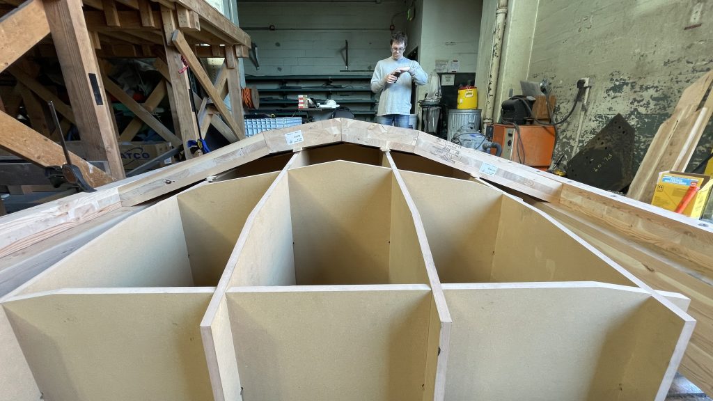 Construction of the mass-timber structure at the Structural Research Lab in UW’s More Hall. It’s possible to see the layers of boards that compose mass timber.