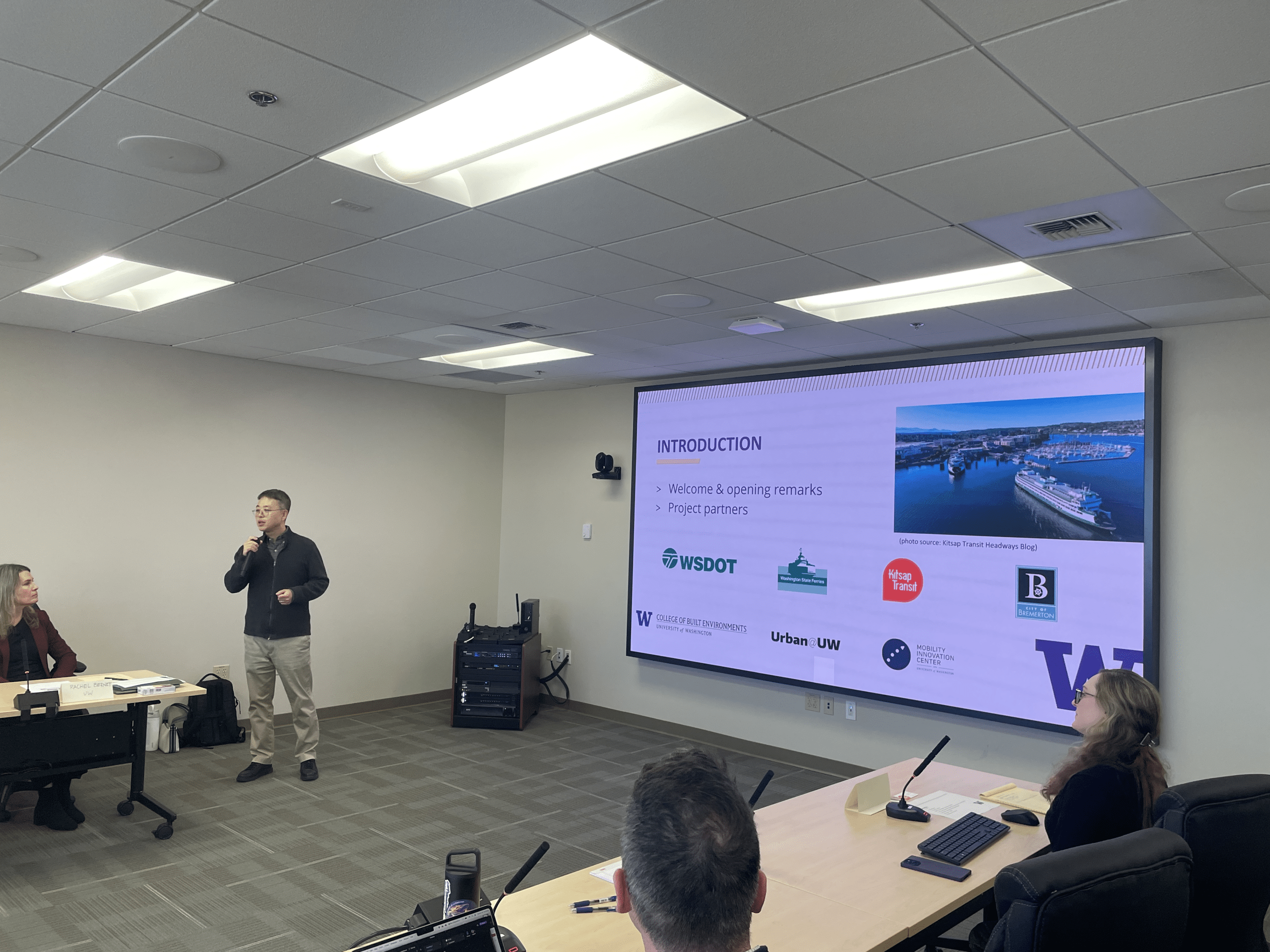 H.W. Chris Lee giving a powerpoint presentation