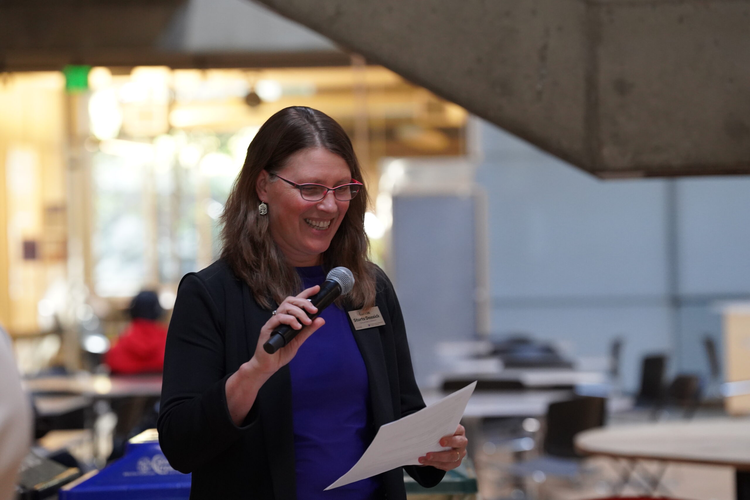 Carrie Dossick with a mic