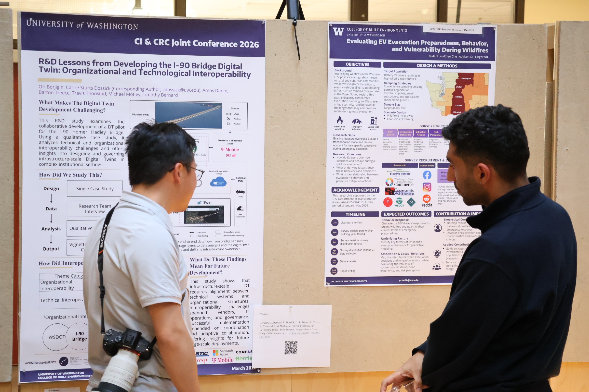 Two people looking at research posters